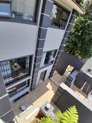 an overhead view of a building with a patio at 16 Sleeper Holiday Home-Mansion in Hartbeespoort