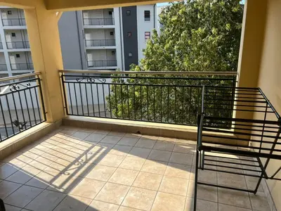 a balcony with a bench on a balcony at Spacious Midrand 3 Bedroom Near Gallagher, MOA & Gautrain in Midrand