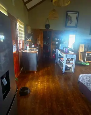 a living room with a kitchen and a table in it at Mathian Farm lifestyle in Tonteldoos