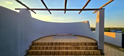 a set of stairs leading up to a balcony at Penthouse Menlyn in Pretoria
