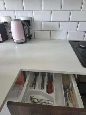 a kitchen sink with utensils in a drawer at Bachelor in Hatfield in Pretoria