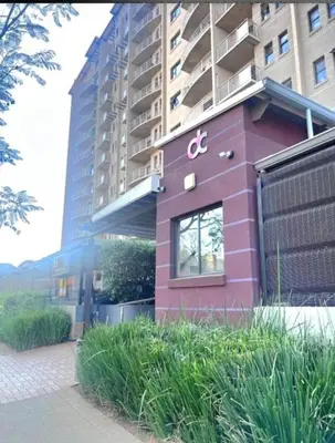 a pink building with the letter c on it at Bachelor in Hatfield in Pretoria