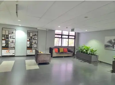 a waiting room with two chairs and a couch at Bachelor in Hatfield in Pretoria