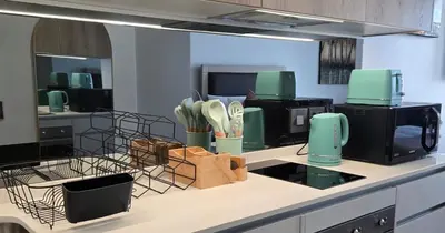 a kitchen with a counter top with appliances on it at Serenity Escape at Ellipse Waterfall in Midrand