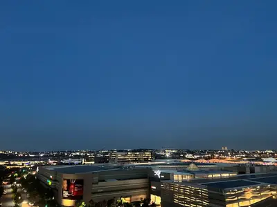 a view of a city skyline at night at Executive Studio at Ellipse Galileo - Waterfall in Midrand