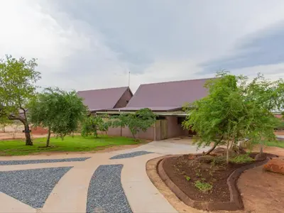 a building with a walkway in front of it at Africana Properties The Village 25 in Hoedspruit
