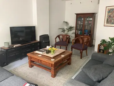 a living room with a couch and a coffee table at UrbanStay in Pretoria