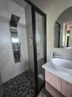 a bathroom with a sink and a glass shower at Highland Gate 948 in Dullstroom
