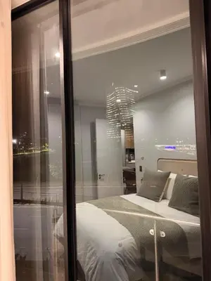 a bedroom with a large glass window with a bed at Riviera Château de Rêve - Phoenix's Gîte at Ellipse Waterfall, Midrand in Midrand