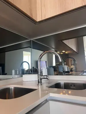 a kitchen with a sink and two faucets at Riviera Château de Rêve - Phoenix's Gîte at Ellipse Waterfall, Midrand in Midrand