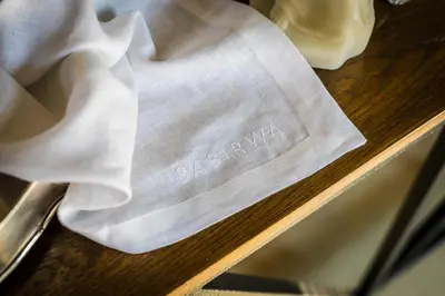 a napkin sitting on top of a wooden table at Babirwa in Rooiberg
