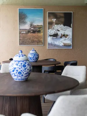 two blue and white vases on tables in a restaurant at Babirwa in Rooiberg