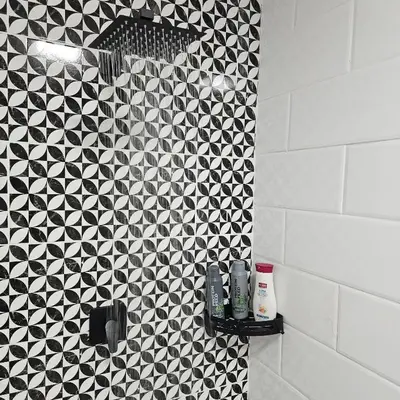 a bathroom with a black and white tiled wall at 14 Isabel Room 2 in Centurion