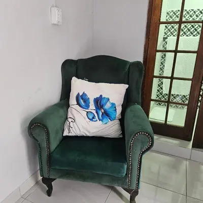 a green chair with a pillow in a room at 14 Isabel Room 2 in Centurion