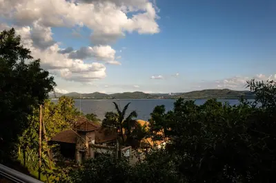 a house with a view of a body of water at Shekinah Cabin in Hartbeespoort