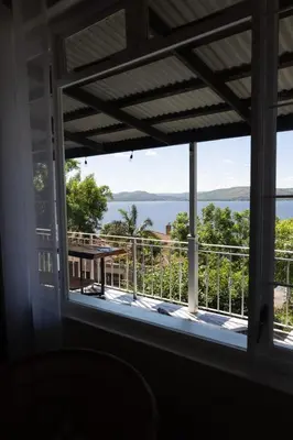 a window view of the ocean from a house at Shekinah Cabin in Hartbeespoort