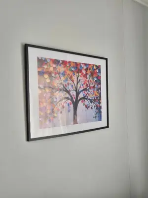 a framed painting of a tree on a wall at One Palm at Ellipse Waterfall in Midrand