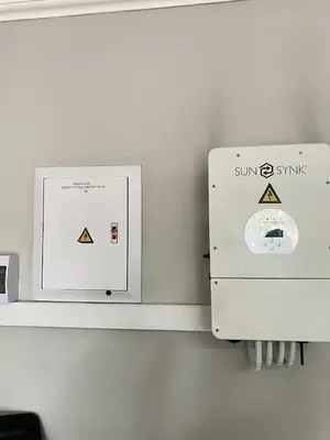 a white box on a wall next to a shelf at Asanda Retreat in Kempton Park