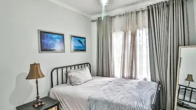 a bedroom with a bed and a window at Cottage Protea in Doornrandjies