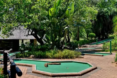a pool table in the middle of a garden at Cambalala - Luxury Units - in Kruger Park Lodge - Serviced Daily, Free Wi-Fi in Hazyview