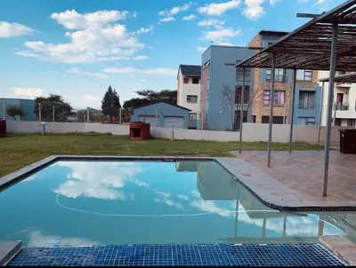 an empty swimming pool in an apartment building at 2 bed room apartment in the heart of midrand in Erand