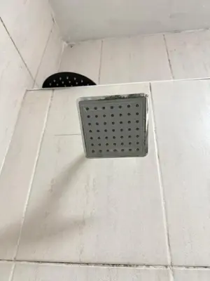 a metal grate on the wall of a shower at 2 bed room apartment in the heart of midrand in Erand