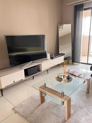 a living room with a large flat screen tv at Midrand Urban Escape in Midrand