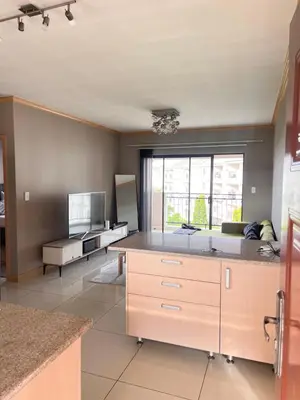 a kitchen with a large island in a room at Midrand Urban Escape in Midrand