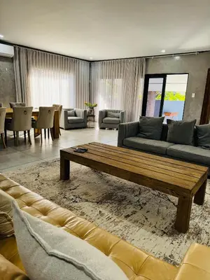 a living room with a couch and a coffee table at Bras boutique in Steelpoort
