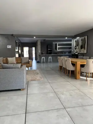 a kitchen and living room with a table and chairs at Bras boutique in Steelpoort