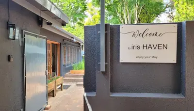 a sign on the side of a building at Iris HAVEN feel at home in Pretoria