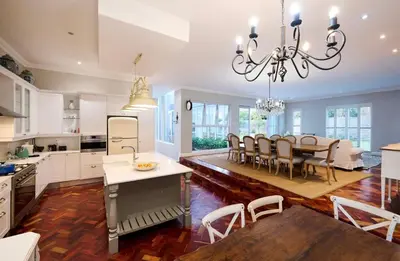 a kitchen and dining room with a table and chairs at The Residence in Midrand