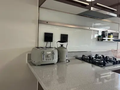 a kitchen counter with a toaster sitting on a counter top at Cozy retreat in Bluehills in Midrand