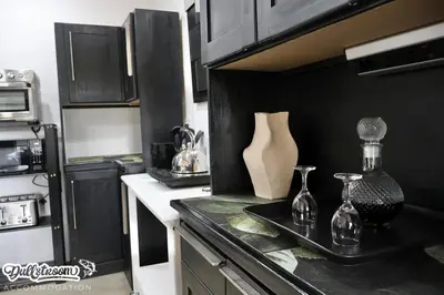 a kitchen with a counter with two glass vases on it at Kilmister Cottage in Dullstroom