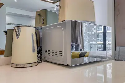 a microwave sitting on top of a counter at Studio apartment, Ellipse Waterfall in Midrand