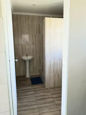 a bathroom with a sink and a toilet at Bredell Motel in Bredell