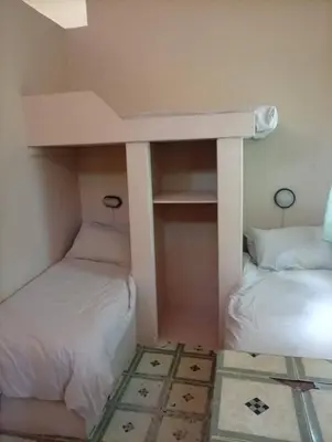 a bunk bed with two beds in a room at Manoutsa Holiday Resort in Hoedspruit