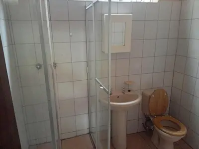 a bathroom with a toilet and a sink at Manoutsa Holiday Resort in Hoedspruit