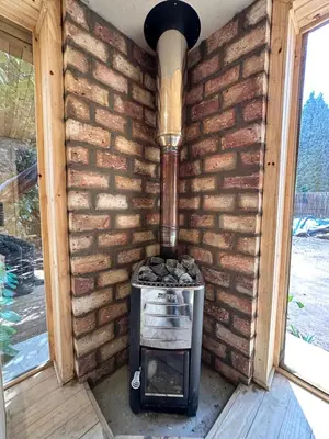 a brick wall with a stove in a room at Little Lions in Dullstroom
