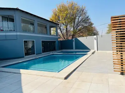 a swimming pool in the backyard of a house at Laconda Rosa in Kriel