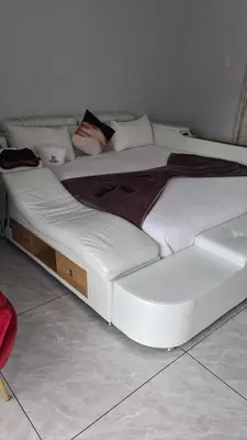 a large white bed sitting in a room at Laconda Rosa in Kriel