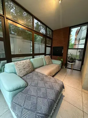 a living room with a couch and a tv at The City Escape in Midrand