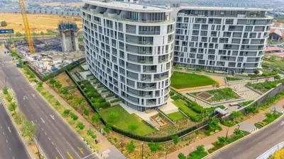 an aerial view of a tall building next to a road at RestHaus Suite, Ellipse Waterfall in Midrand