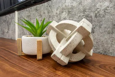 two white vases sitting on a wooden table with a plant at RestHaus Suite, Ellipse Waterfall in Midrand