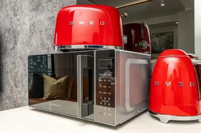 two red toasters sitting on top of a counter at WanderHaus Haven, Ellipse in Midrand