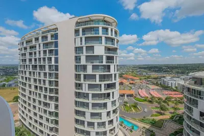 an image of a tall white building at Ellips Smartz Apartment in Midrand