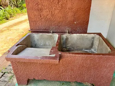 a concrete planter in a red brick wall at Camping at Kanaan in Hazyview
