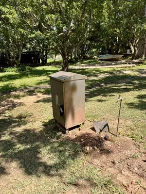 a box sitting in the grass in a park at Camping at Kanaan in Hazyview