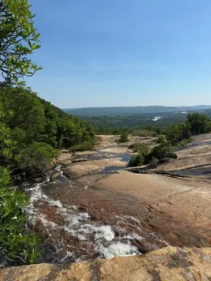 a river on the side of a mountain at Backpackers at Kanaan in Hazyview