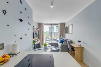 a kitchen and living room with a couch and a table at The Quanta, Ellipse, Watefall in Midrand